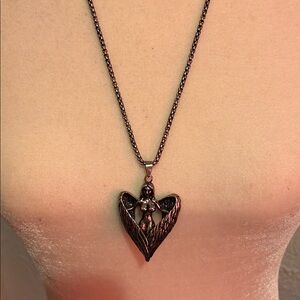 Silver Heart Pendant Necklace with Intricate Design